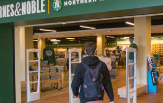 Man walking into NMU's Barne's & Noble Bookstore
