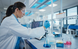 A medical laboratory research scientist prepares biochemical samples for analysis.