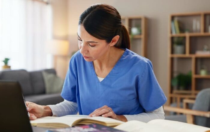 A nurse studies online at home for a college degree